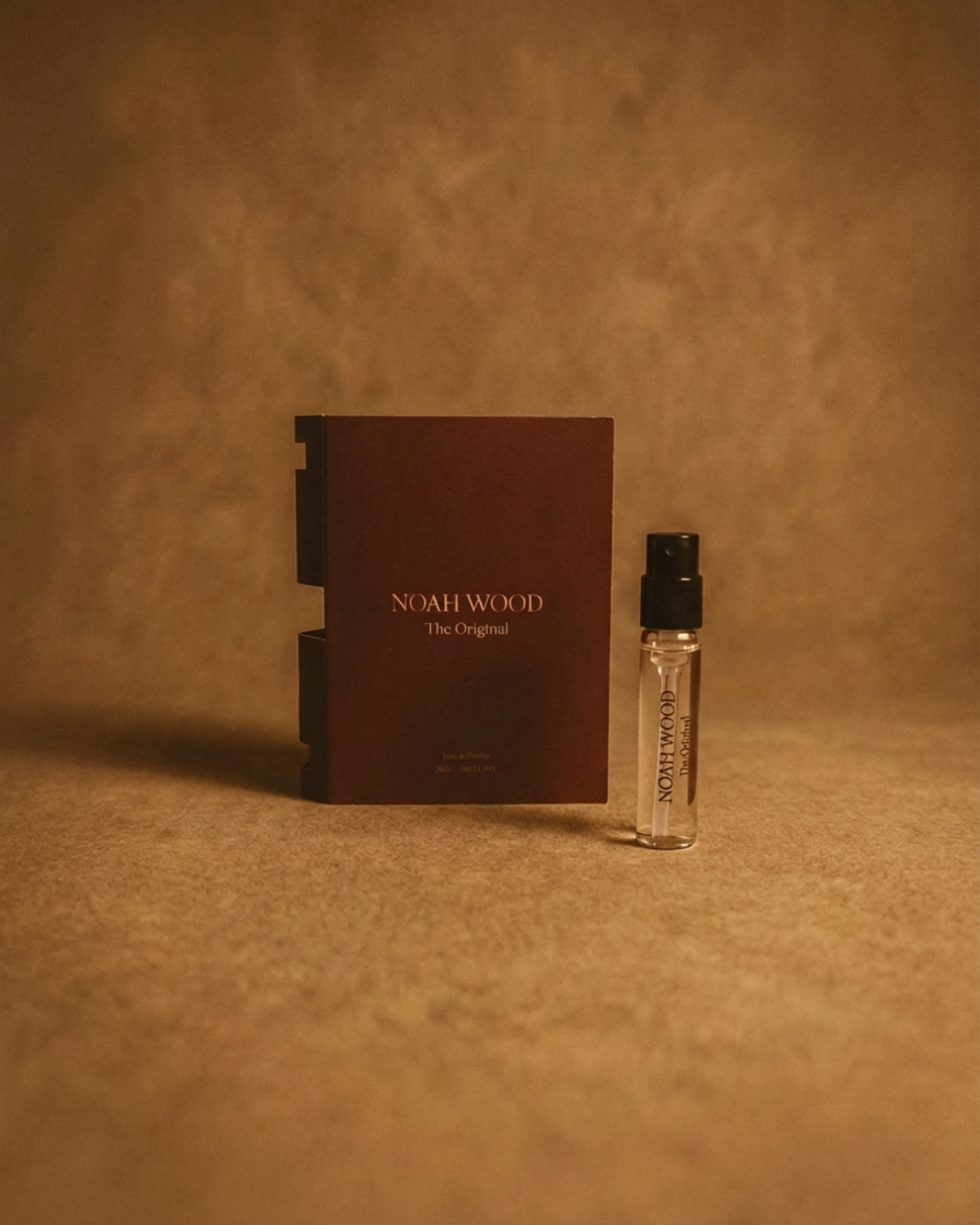Noah Wood perfume packaging on a beige background